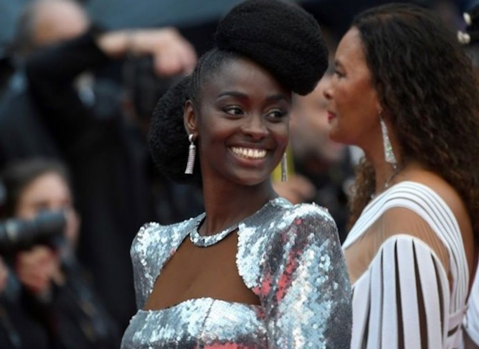 Black actresses brave downpour to protest at Cannes