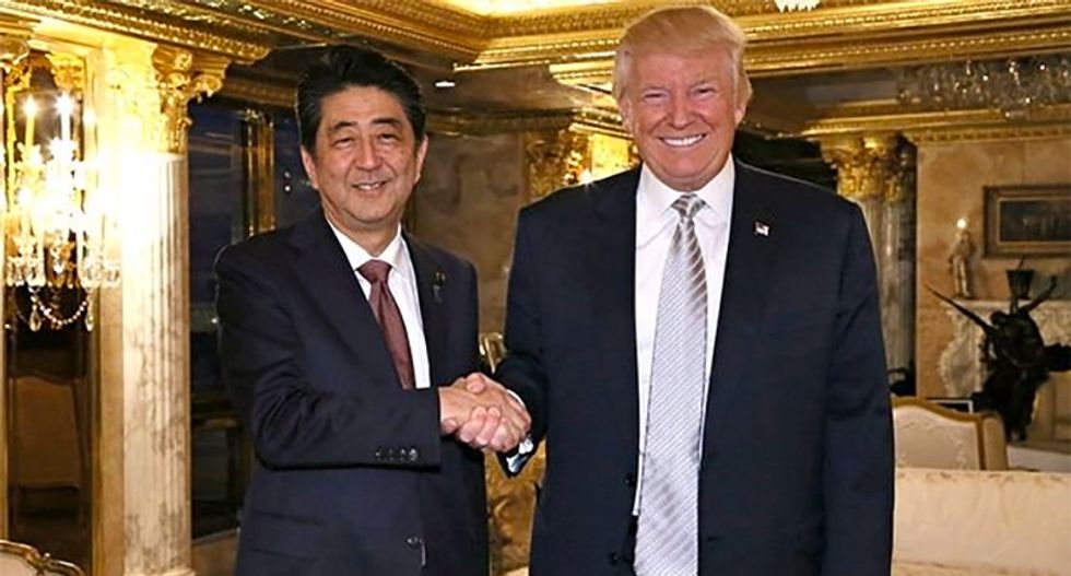 Japan's Abe under pressure at home for 'shameless pandering' to Trump while trying to keep him from doing 'bad stuff'