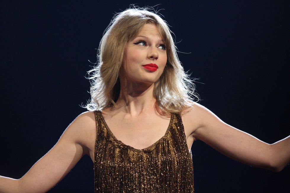 Taylor Swift's lawyers are threatening a lawsuit against a blogger who called on her to denounce white supremacists