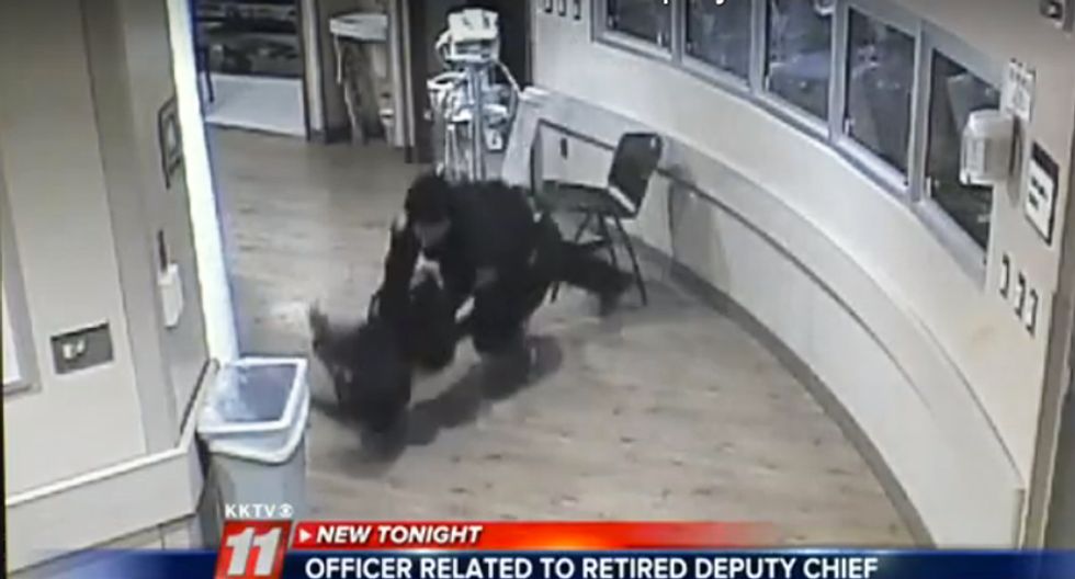 Watch: Colorado cop brutally slams woman to the floor in hospital hallway, knocking out her teeth
