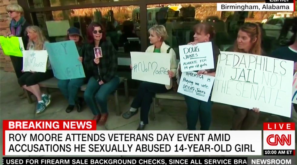 WATCH: Roy Moore hammered at Veterans Day event with 'No Moore' chants and posters calling him a pedophile