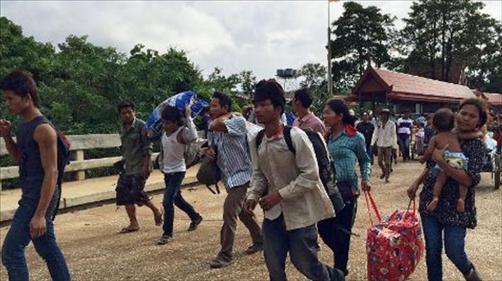 Cambodia slams Thailand as workers flee out of fear of military junta