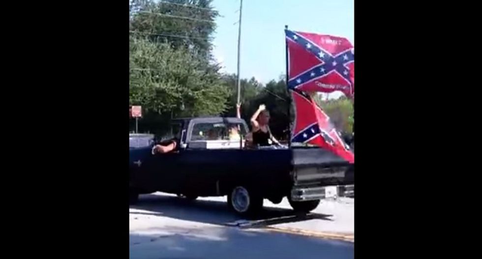 Confederate flag wavers caught yelling racist slurs at black kid's birthday party insist they're not hateful