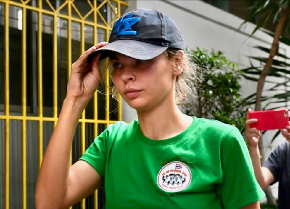 Belarusian model tells conflicting stories about tapes of oligarch admitting to Russian election interference