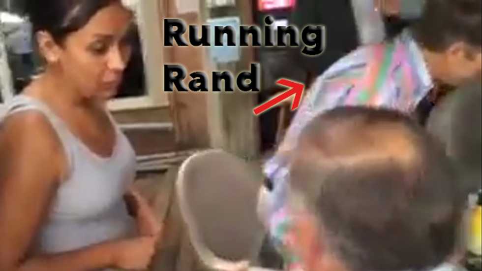 WATCH: Rand Paul literally eats and runs as immigrant activist confronts Iowa Republican