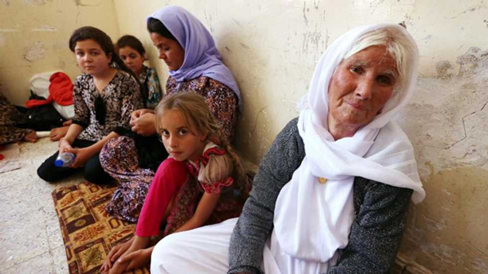 20,000 Yazidi Iraqis targeted by ISIS escape from mountain after US air strikes