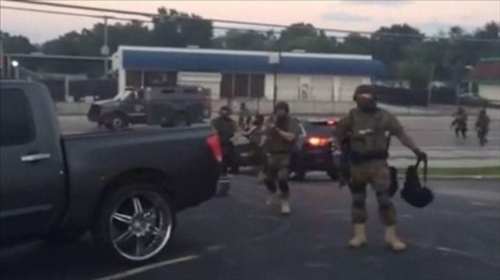 WATCH: Cops aim weapon at local official, lock media out as Ferguson protests continue