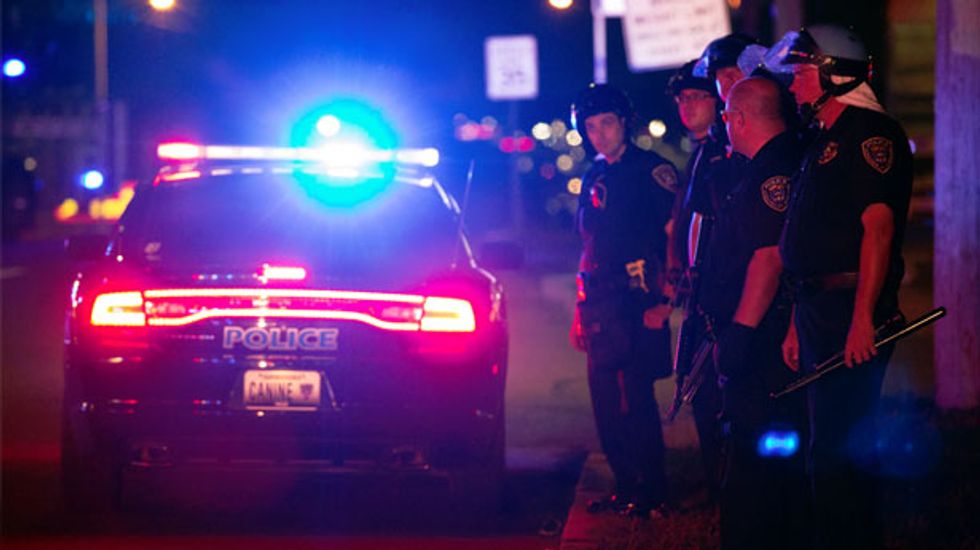Father of Michael Brown calls for peace after two nights of riots in St. Louis suburb
