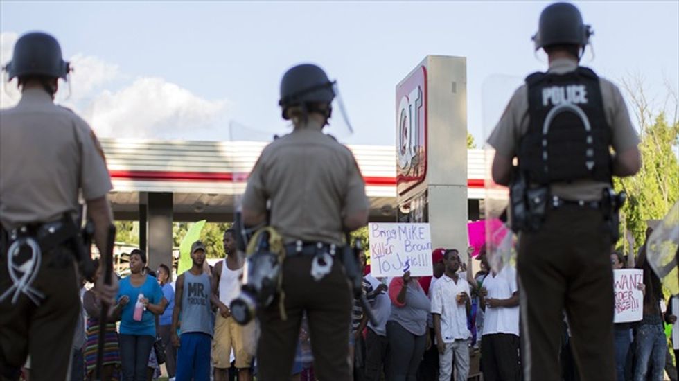 'Overkill': Images from Ferguson protest show cops treating city like a war zone
