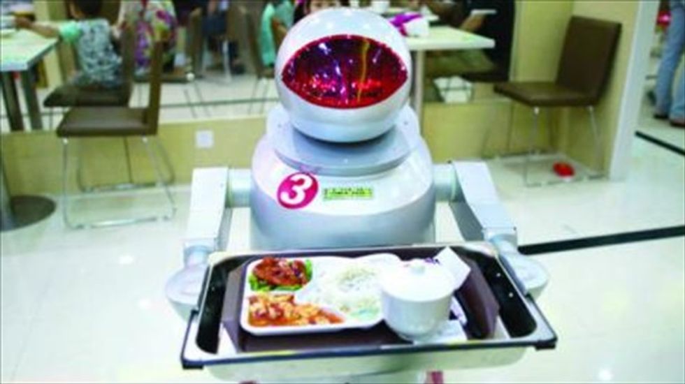 'They can't get sick or ask for vacation': Chinese restaurant unveils robot waiters and cooks