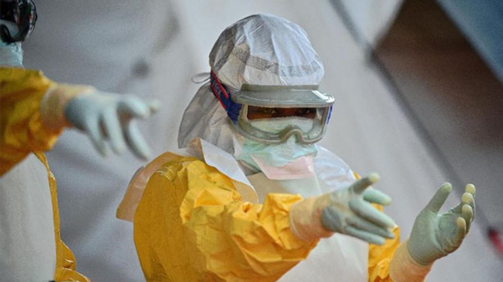 Scientist who identified Ebola virus calls for 'quasi-military intervention'