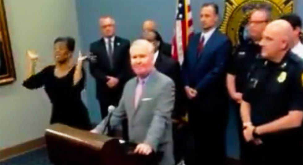 WATCH: Sign language interpreter delivers gibberish after showing up uninvited to police press conference