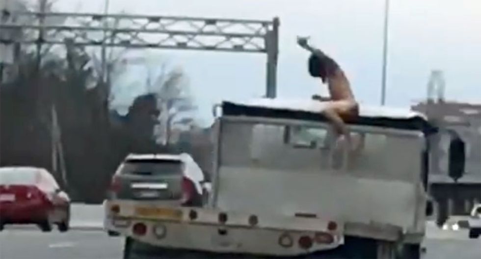 Naked man causes multiple drivers to crash while swerving to avoid him on busy highway