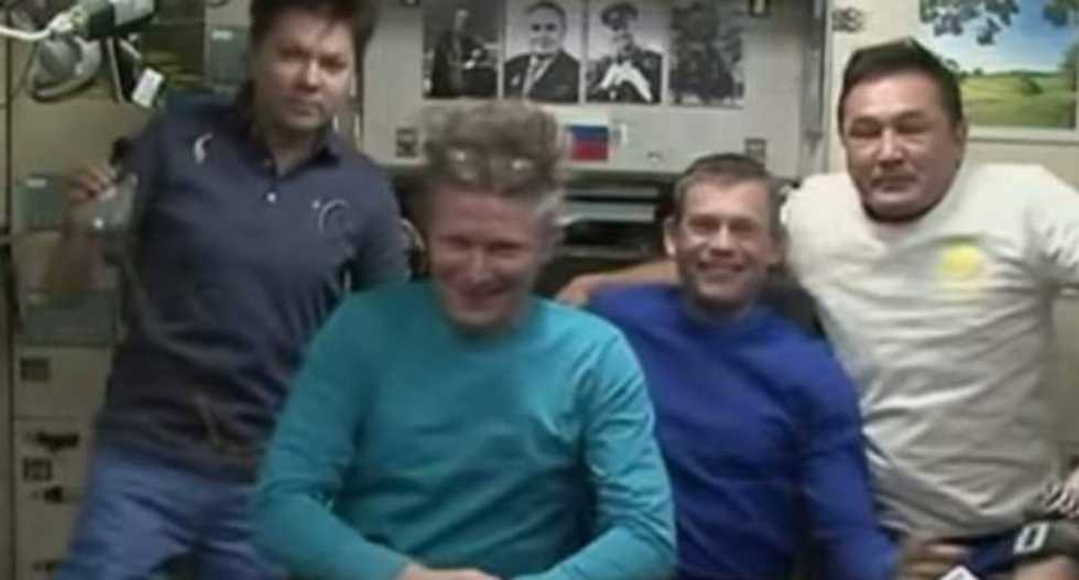 Record-setting cosmonaut begins return trip from International Space Station