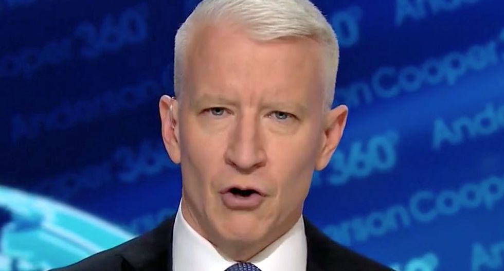 'A political stunt' : CNN's Anderson Cooper slams Sarah Sanders's defense of Trump's Eagles debacle