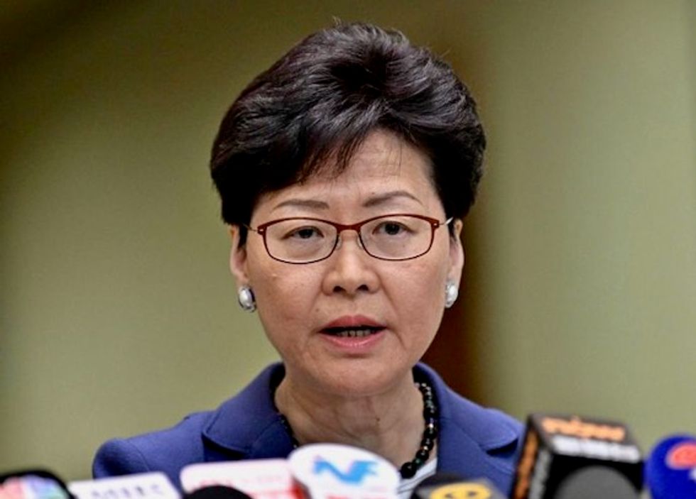 Hong Kong leader apologizes as rally chokes city