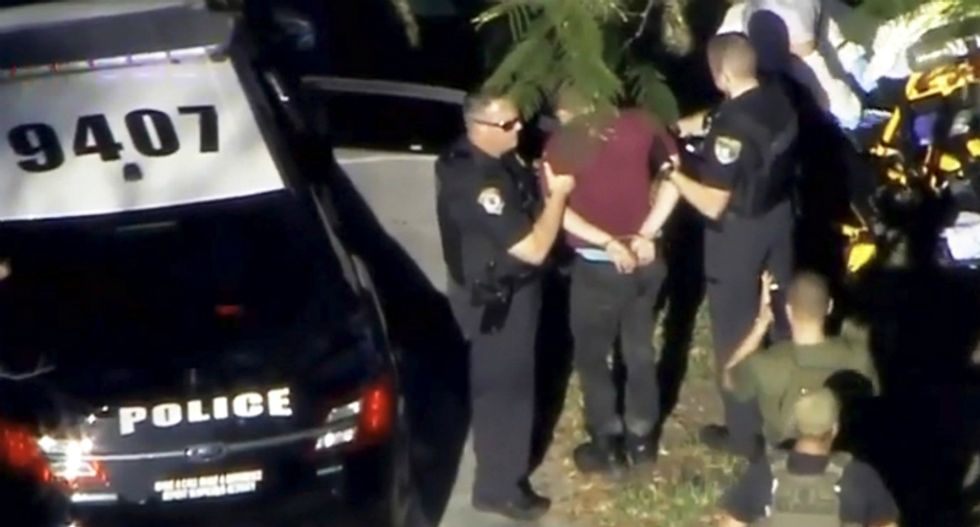 Florida school gunman was a former student banned from campus for threatening classmates