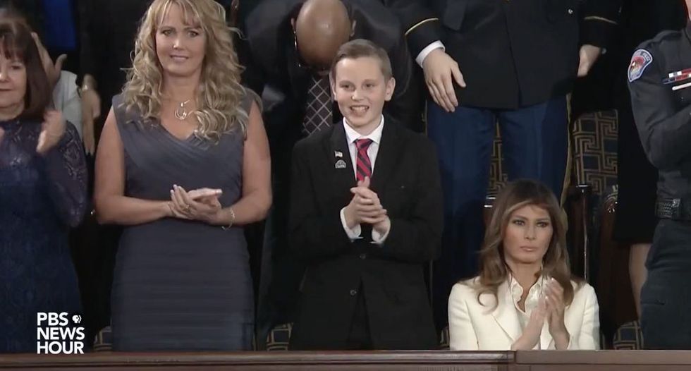 Melania Trump stays seated after husband praises ‘faith and family’ as ‘center of American life’ -- and declares 'in God we trust'