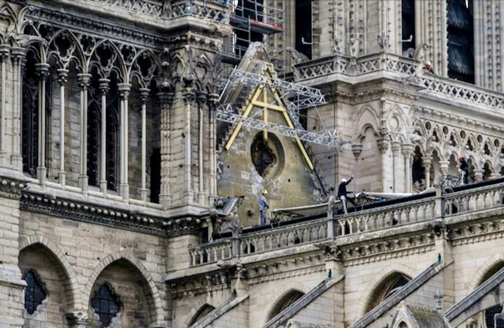Race on to cover Notre-Dame as rainclouds gather over Paris