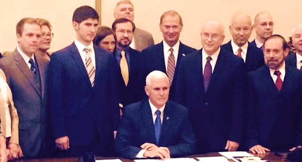Dems hammer Pence for posing with anti-LGBT activists while signing 'religious freedom' bill