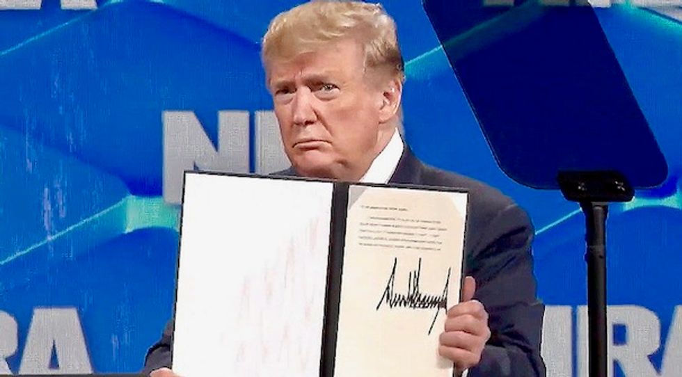Trump thrills NRA members with surprise decision to sign order removing US from global gun regulations treaty