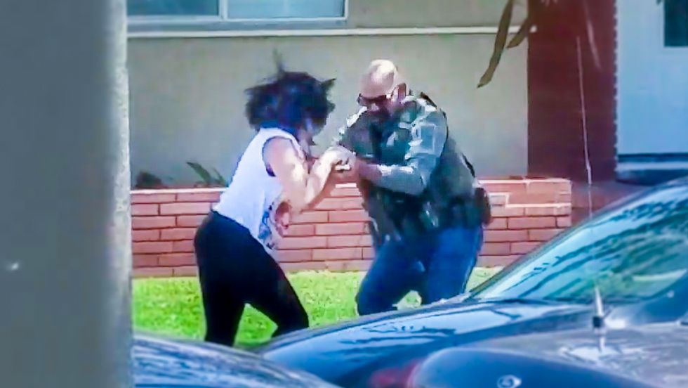 WATCH: US Marshal goes berserk smashing woman's phone for recording him on public sidewalk