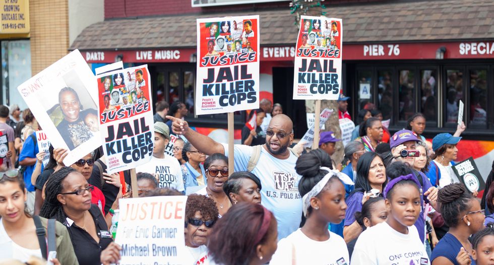 Open carry activists -- strapped with guns -- crash police brutality protest in Dallas
