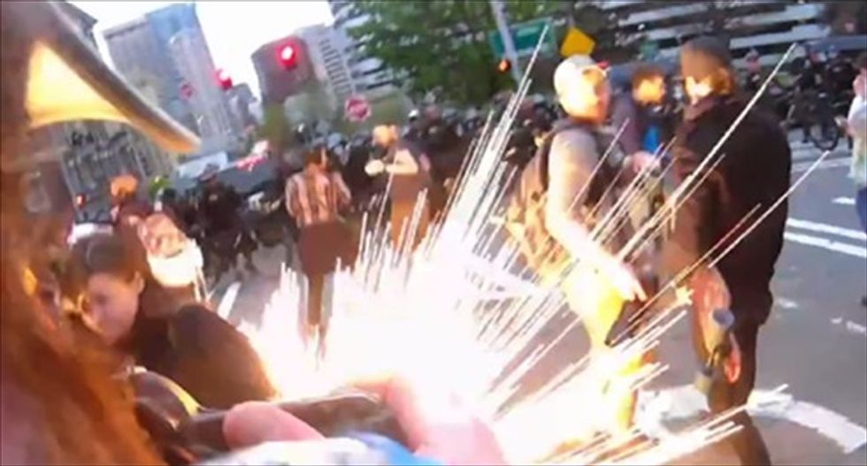 WATCH: Journalist injured as Seattle cops throw flashbang grenade at protesters