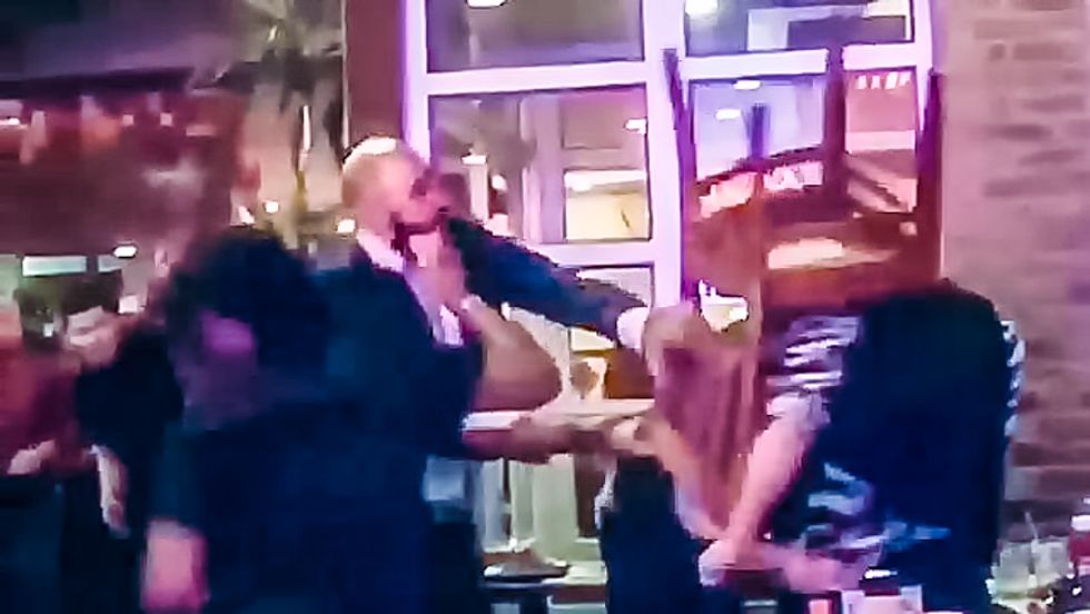 Cell phone video shows gay couple bashed over the head with chair at Dallas BBQ in Manhattan