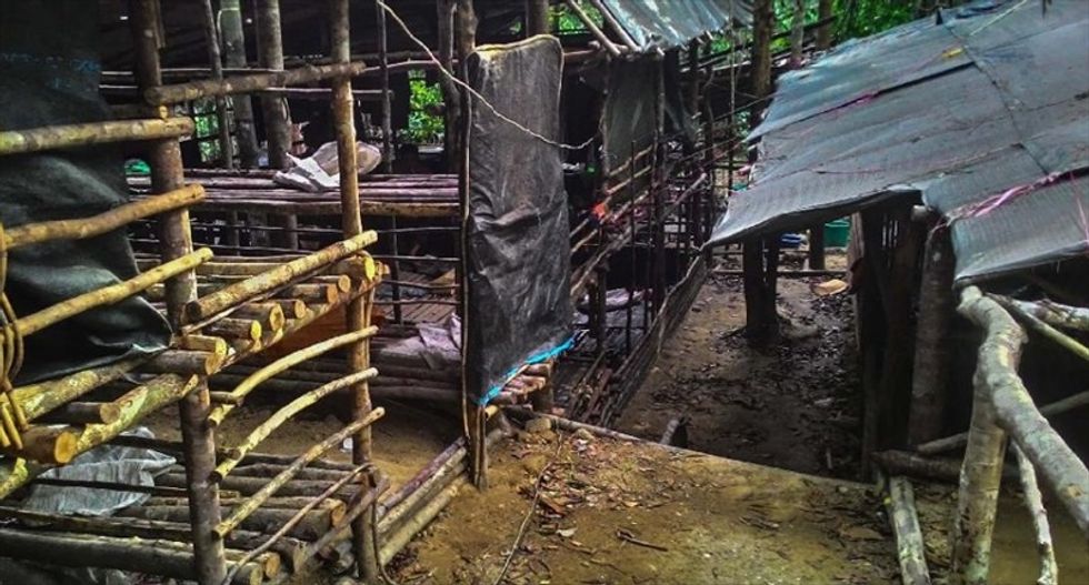 Malaysian officials find 139 grave sites in immigrant trafficking camps