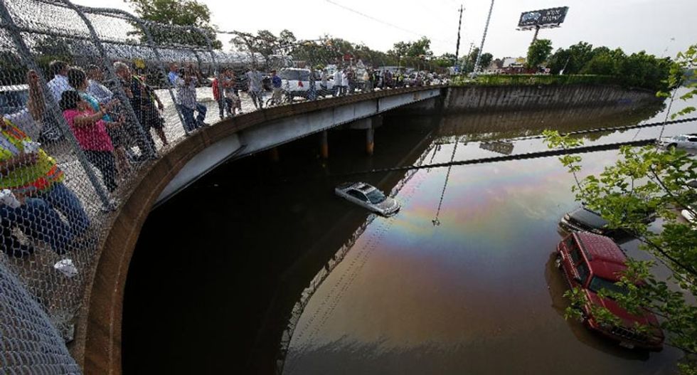 Houston submerged as wild weather kills 20 in US and Mexico