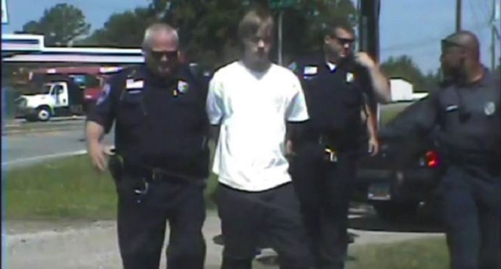 Video shows cops celebrate their arrest of Dylann Roof with fist bumps and high fives