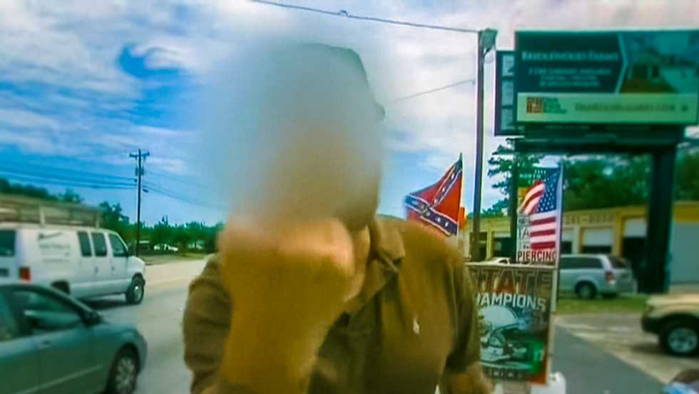 Irate middle-finger waving Confederate flag vendor stalks CNN reporter: 'You're stirring sh*t up'