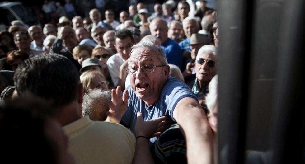 Thousands of angry elderly Greek pensioners besiege banks to grab cash