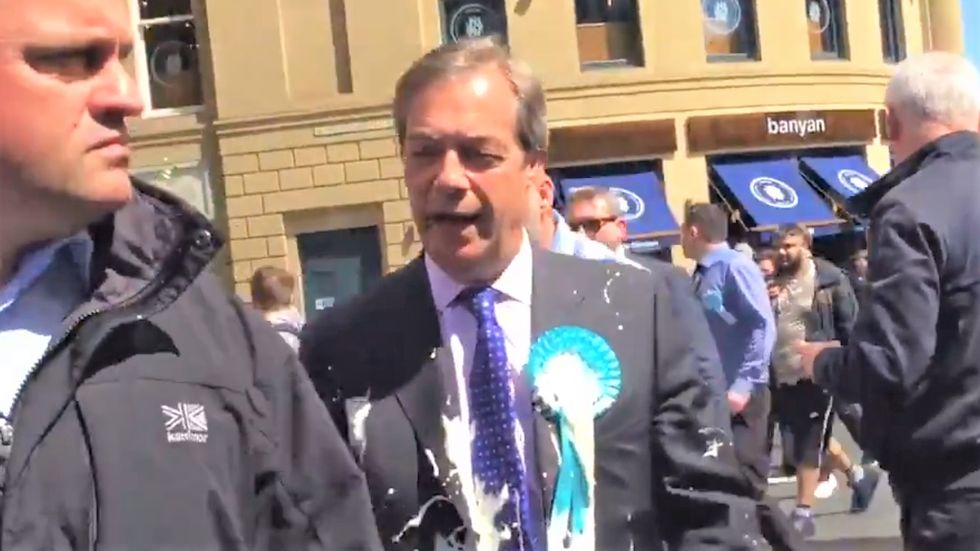 WATCH: Trump-loving British right-winger gets doused with a milkshake by anti-racism protester