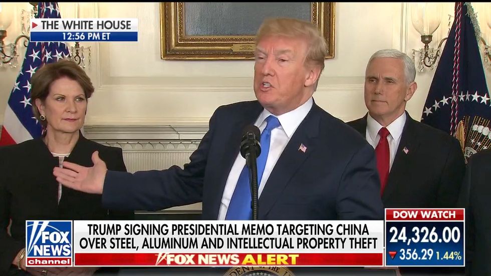 Even Fox News jabs Trump with split-screen of plummeting stock market as he signs new tariffs