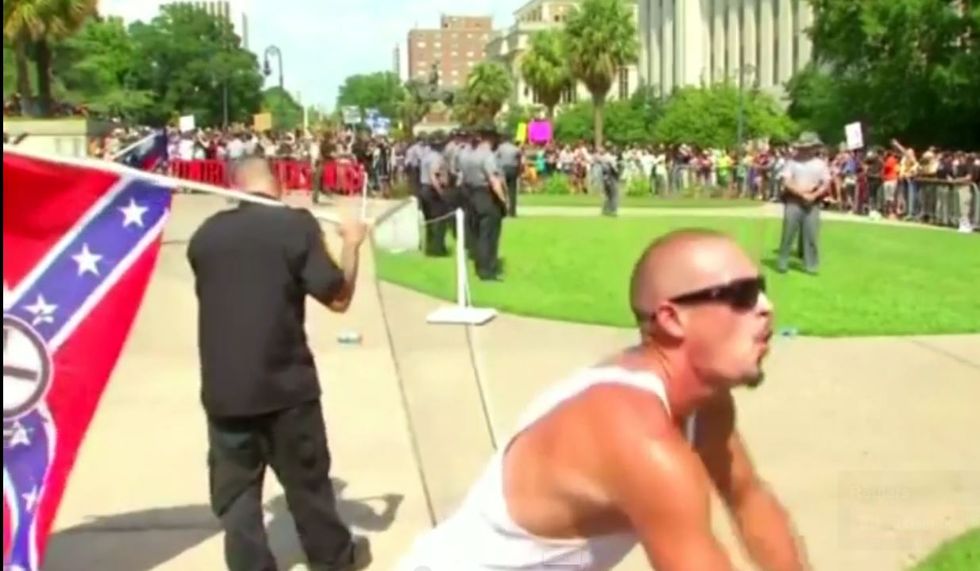 WATCH: KKK supporter uses 'gorilla' taunts to mock black crowd during tense Confederate flag rally