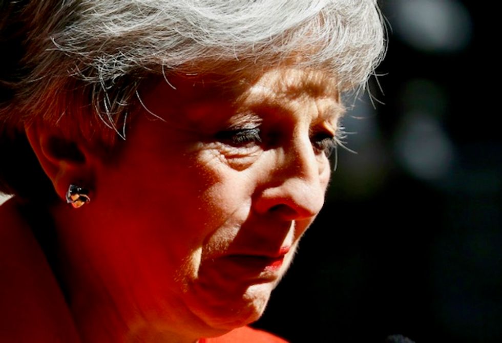 Britain's May announces resignation in emotional end