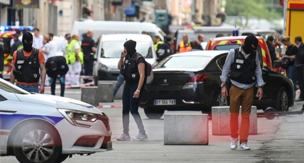 French police arrest four over Lyon package bomb blast