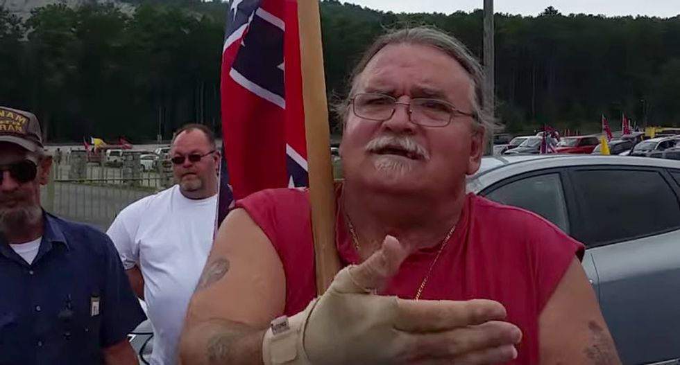 WATCH: Clueless Klansman at Confederate flag rally confronted for wearing FUBU shoes