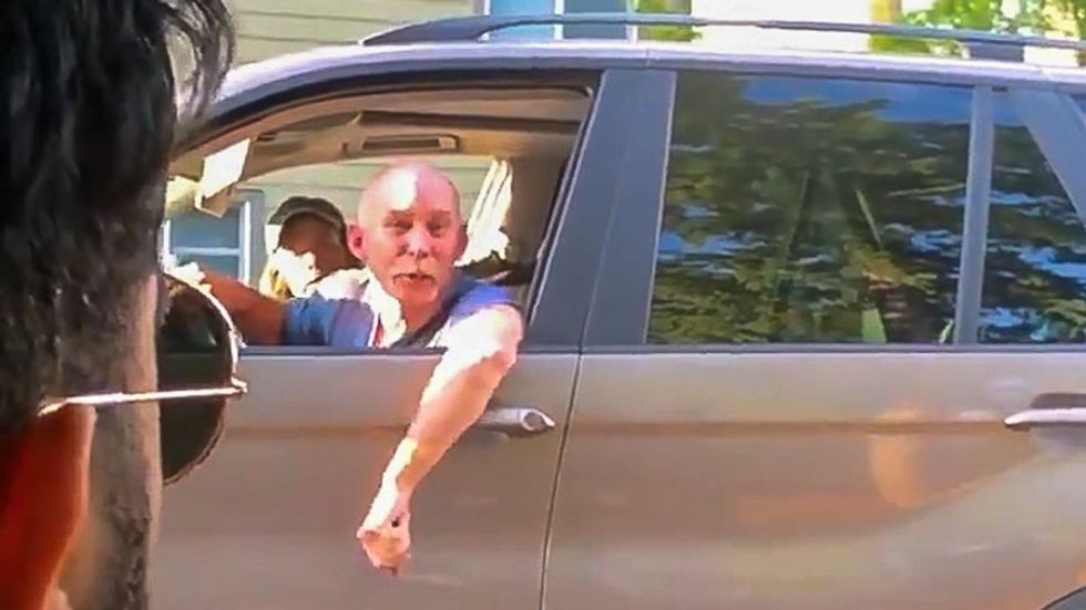 Raging white driver caught on video telling woman to 'shut up' before calling man of color 'dumb sand n****r'