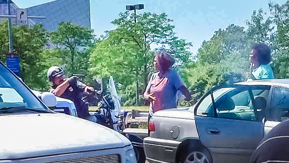 Viral photo shows Cleveland cop pointing gun at two unarmed black women at scene of hit-and-run
