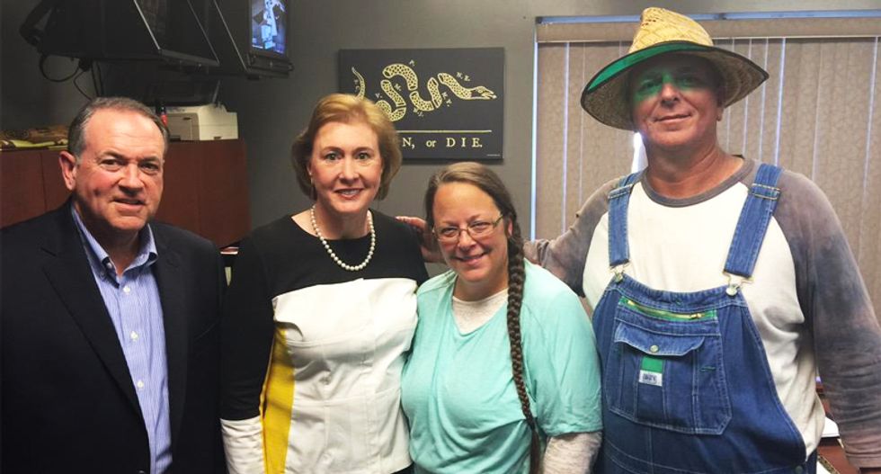 Mike Huckabee and Kim Davis’ overalls-clad husband get the Twitter treatment — and it’s hilarious