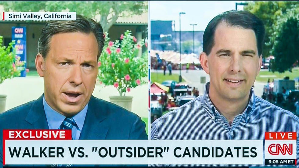 CNN host calls out Scott Walker backing Koch 'special interests' while defunding Planned Parenthood