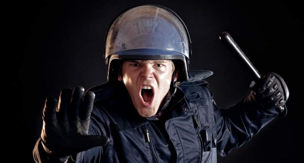 Police should put away the military gear and build connections with young people