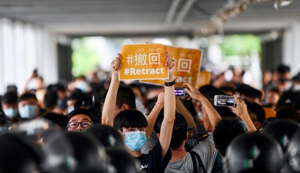 Hong Kong protesters march on station to 'educate' Chinese mainlanders