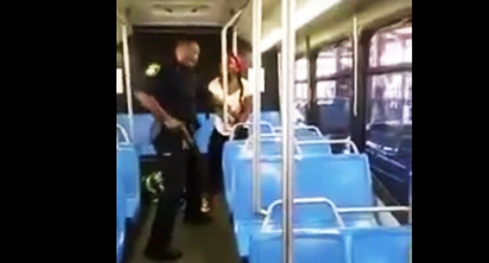 WATCH: Boston cop arresting black woman holsters weapon after witnesses beg him 'drop the gun'