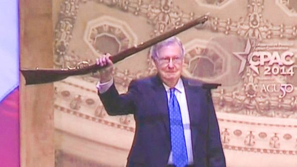 Mitch McConnell takes CPAC stage holding a rifle as 'Living on a Prayer' plays