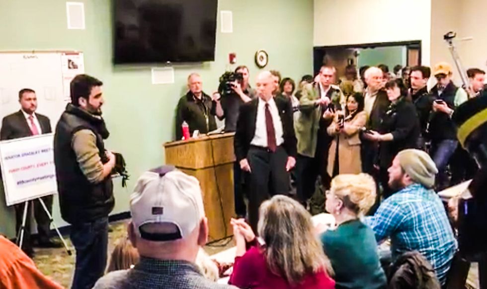 WATCH: GOP senator jeered after ducking travel ban question from Afghan man who served with US troops