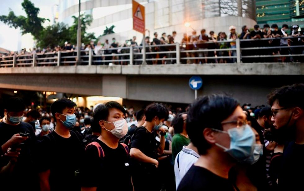 Thousands converge on Hong Kong police HQ in anti-government demo